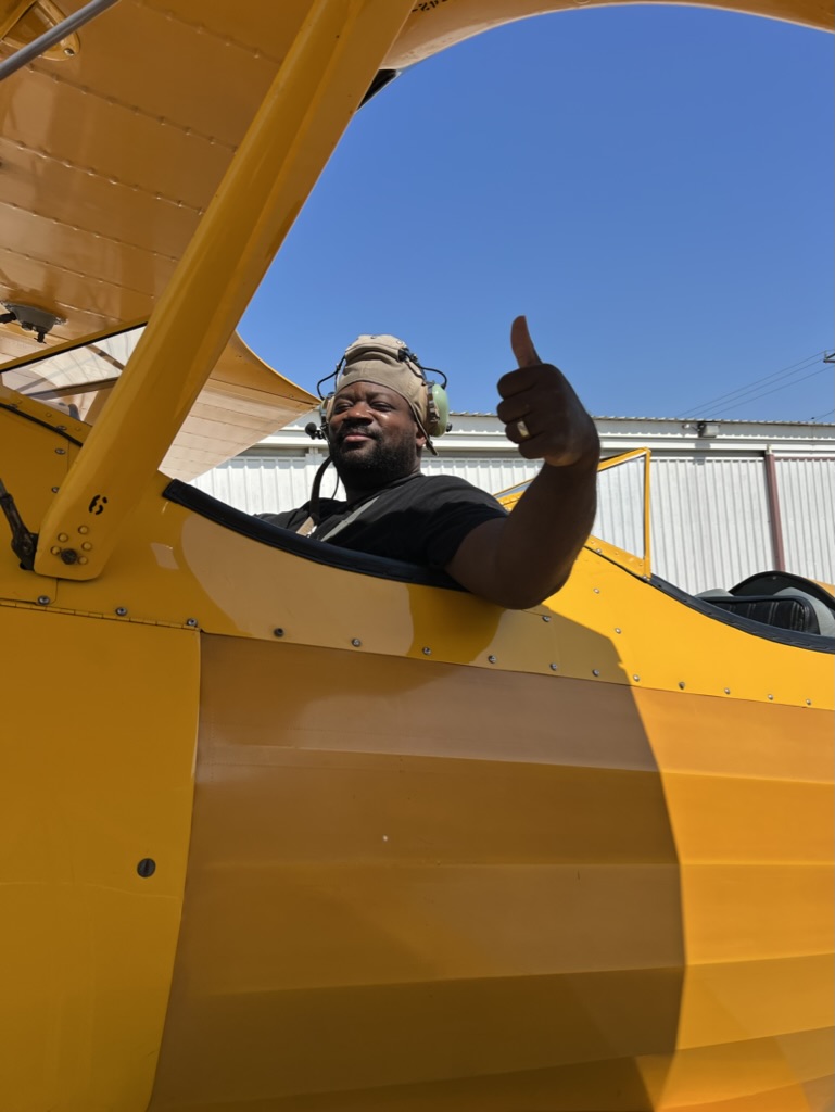 a picture to be used as a headshot of me in an airplane for my bio